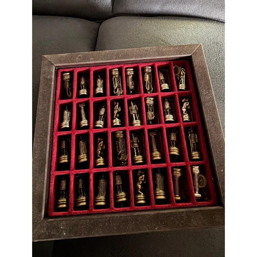 manopoulos chess set with Greek mythology pieces and guide.